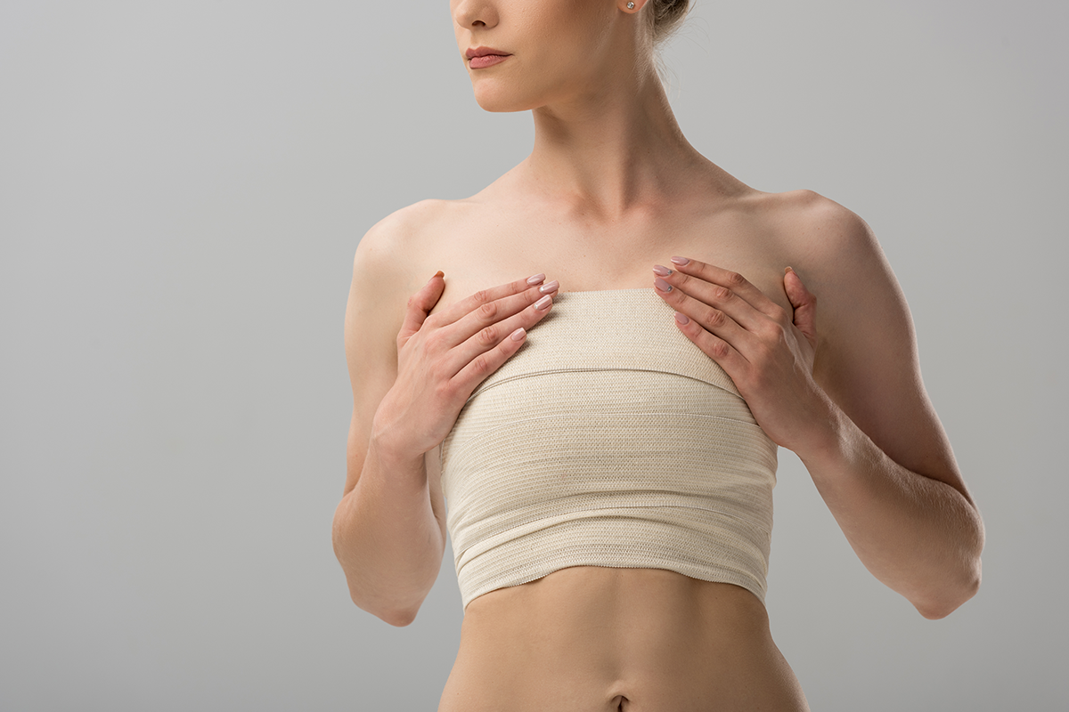 woman with breast bandage woman with breast bandage